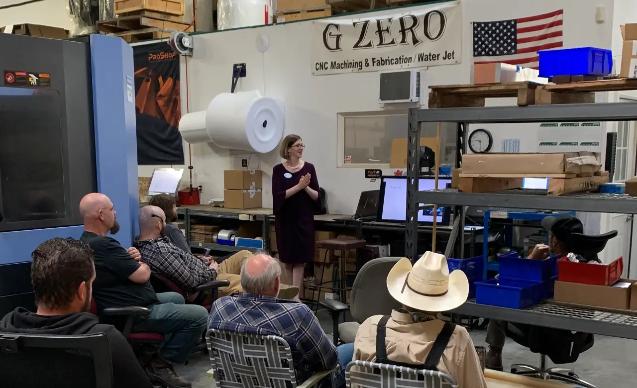 Sarah leads a training in a workshop setting